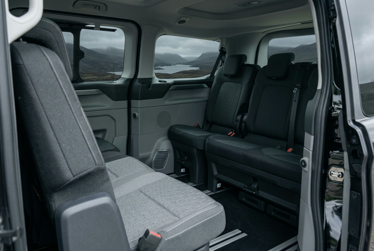 Interior of the black Ford Tourneo Custom showing heated rear seats with generous legroom
